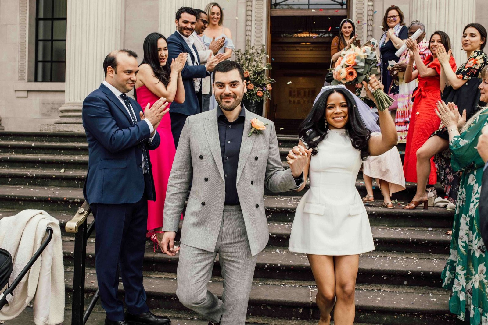 Newlyweds smiling with guests after their ceremony — Adrian Mazur wedding portfolio