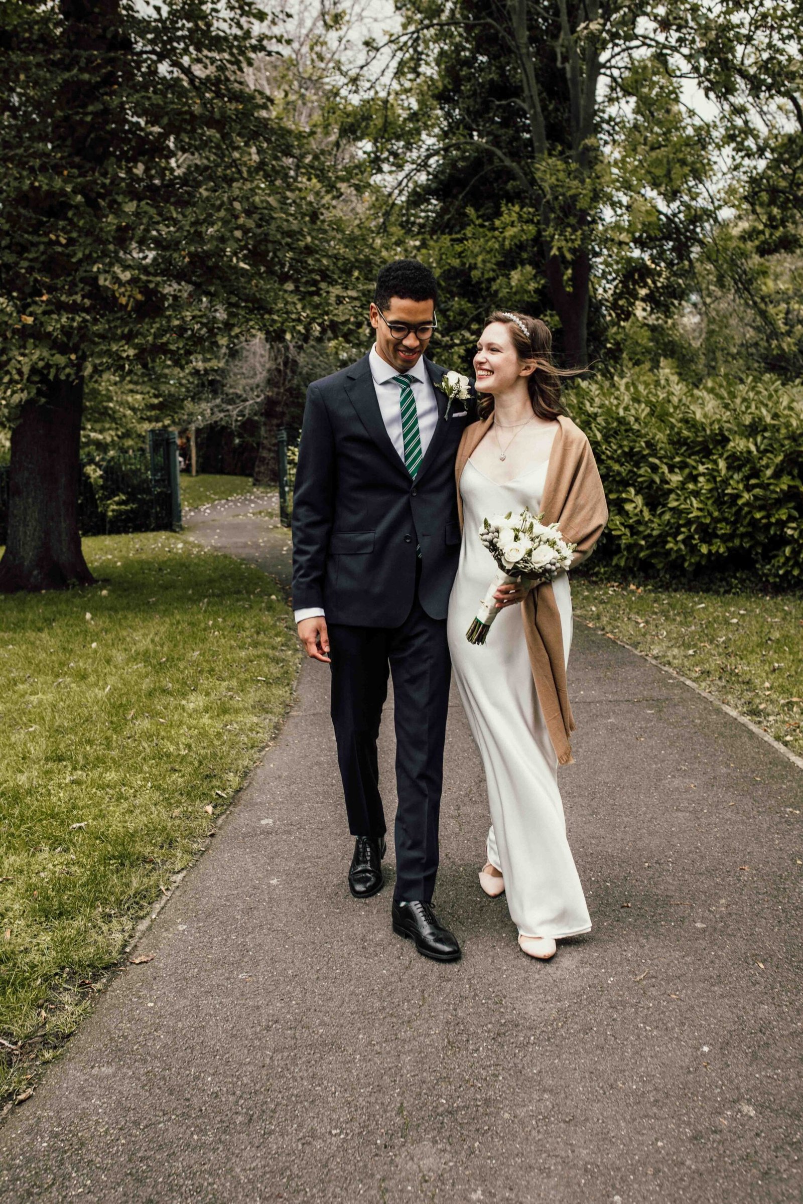 Katherine and Nathanaël walking together through the gardens