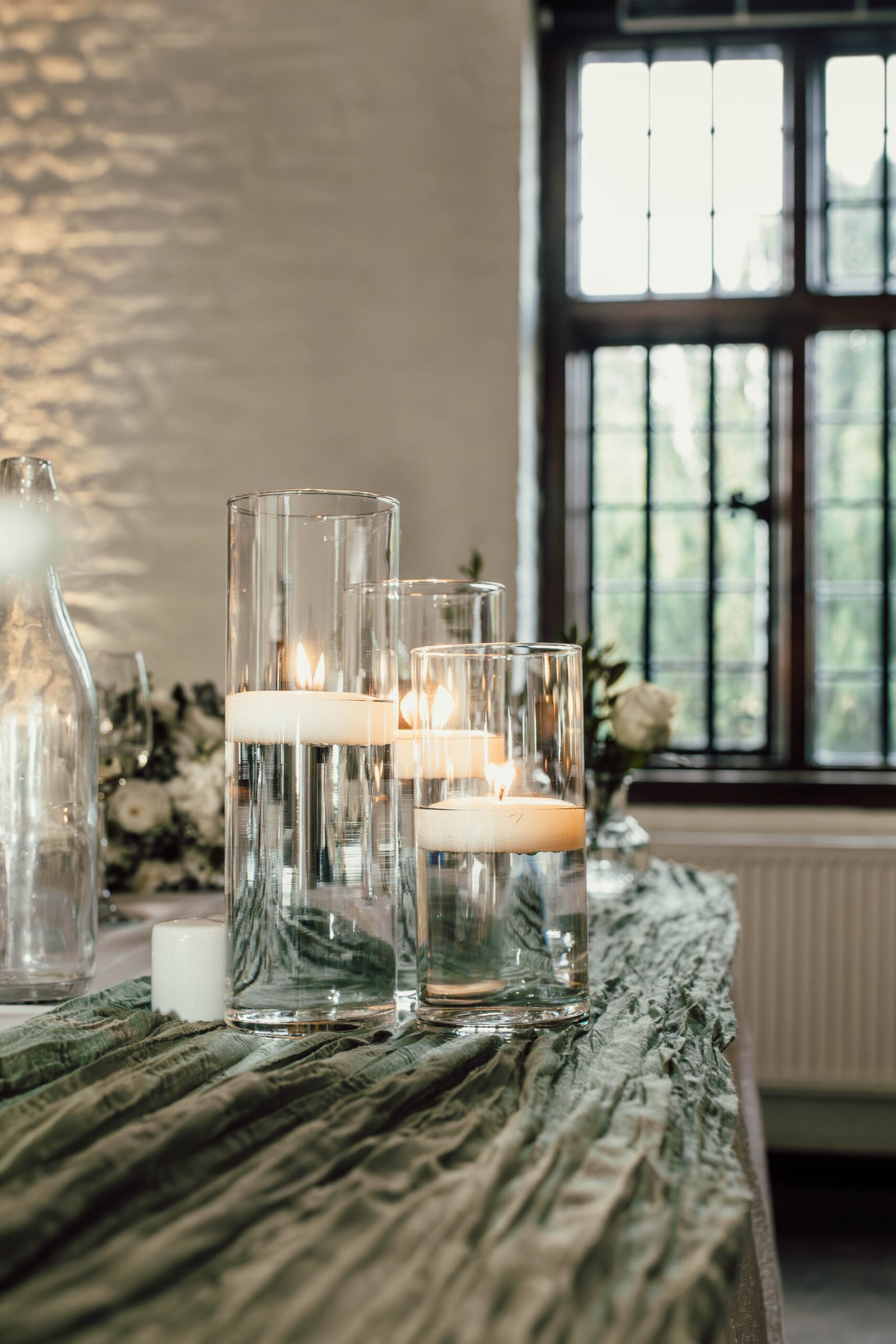 Wedding table details beside a window at Tudor Barn Eltham