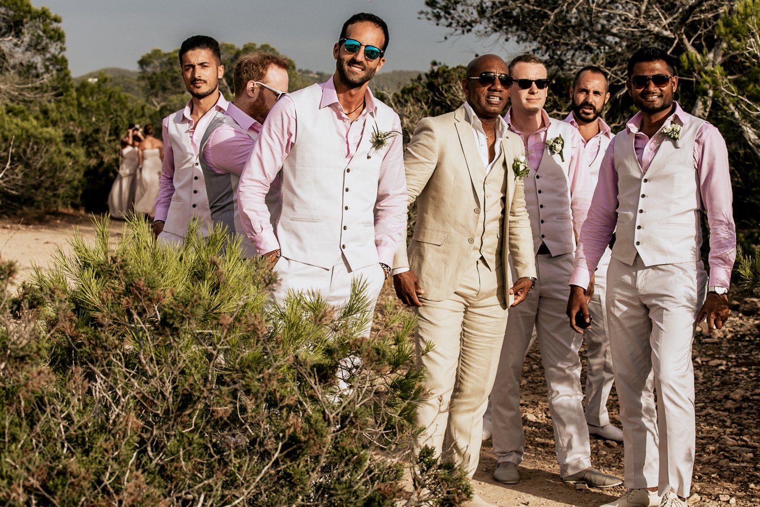 Mike walking with his wedding party towards the ceremony