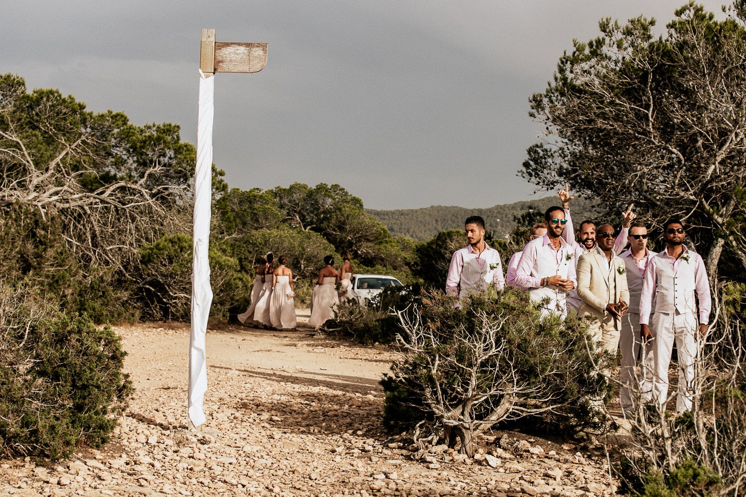 The wedding party arriving along a coastal path