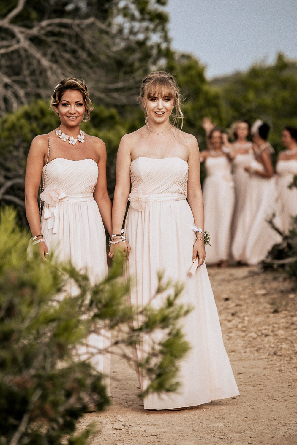 Monica walking towards the ceremony with her bridesmaids