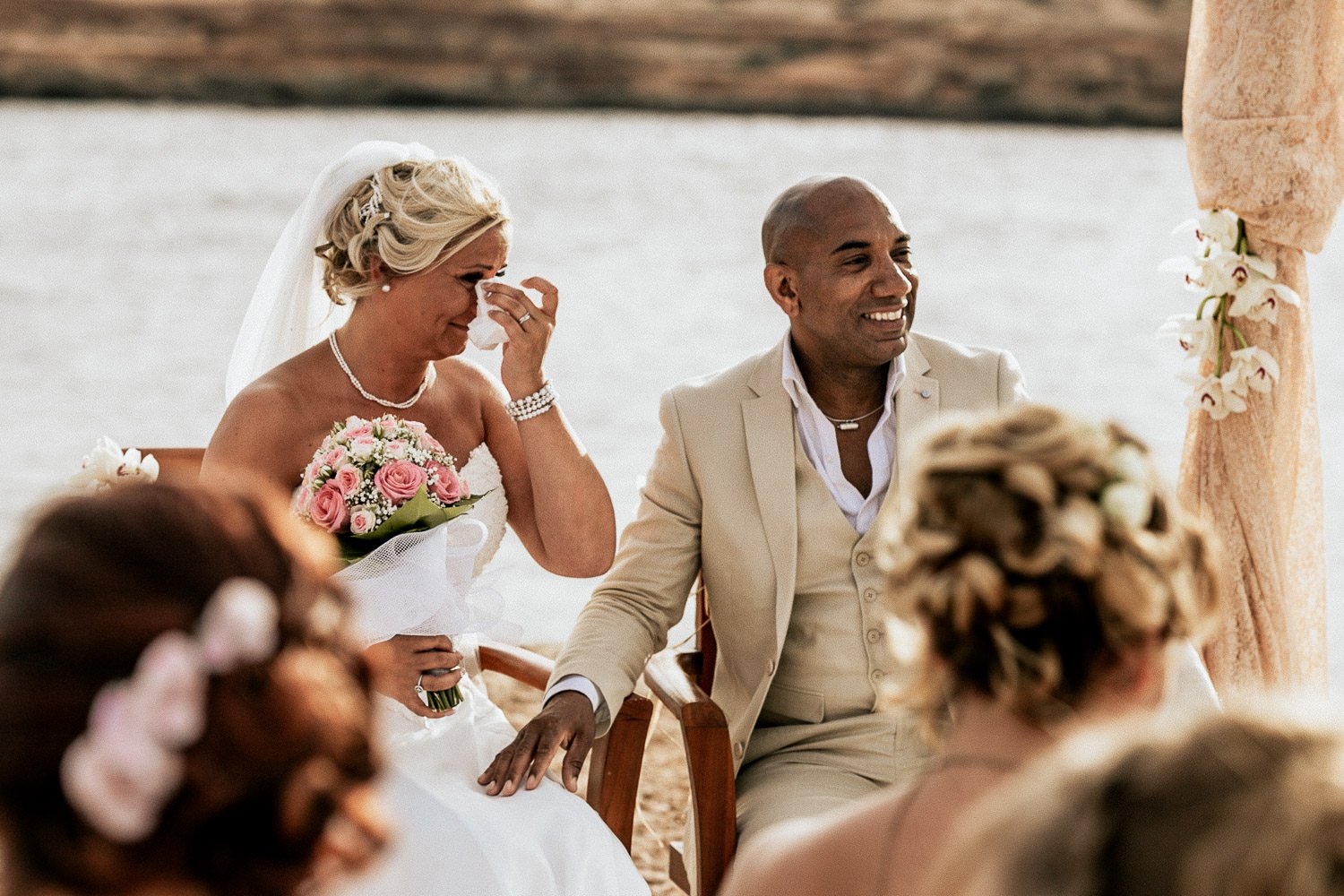Mike and Monica smiling during the ceremony