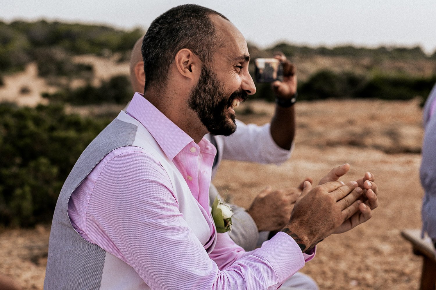 A guest applauding during the wedding ceremony
