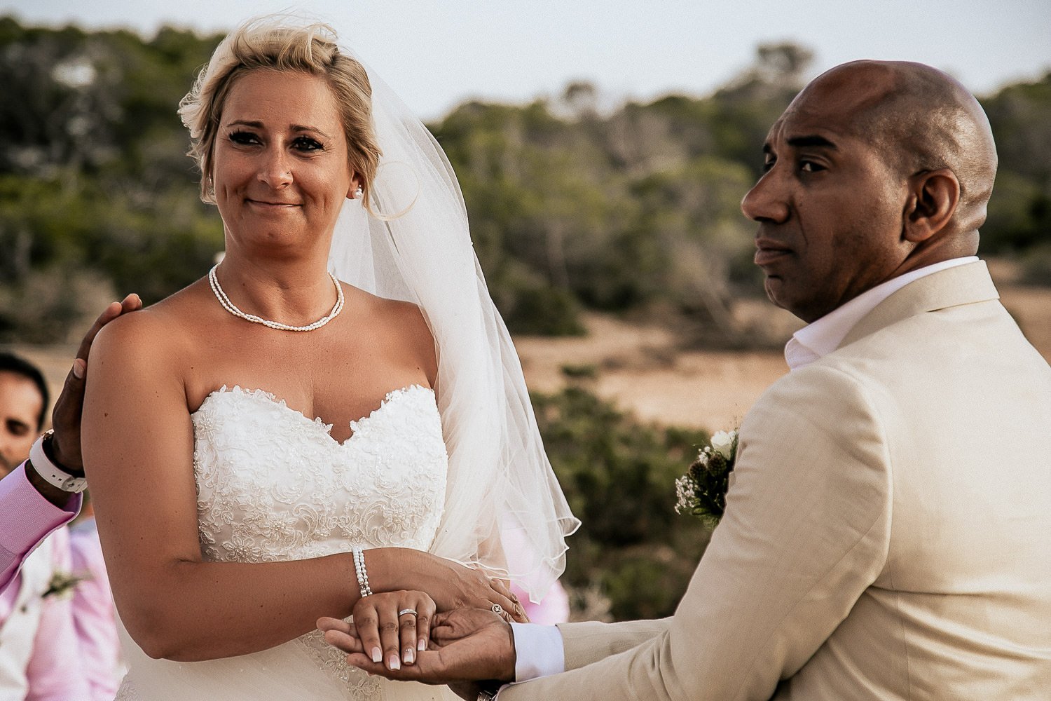Monica smiling with Mike during their wedding ceremony