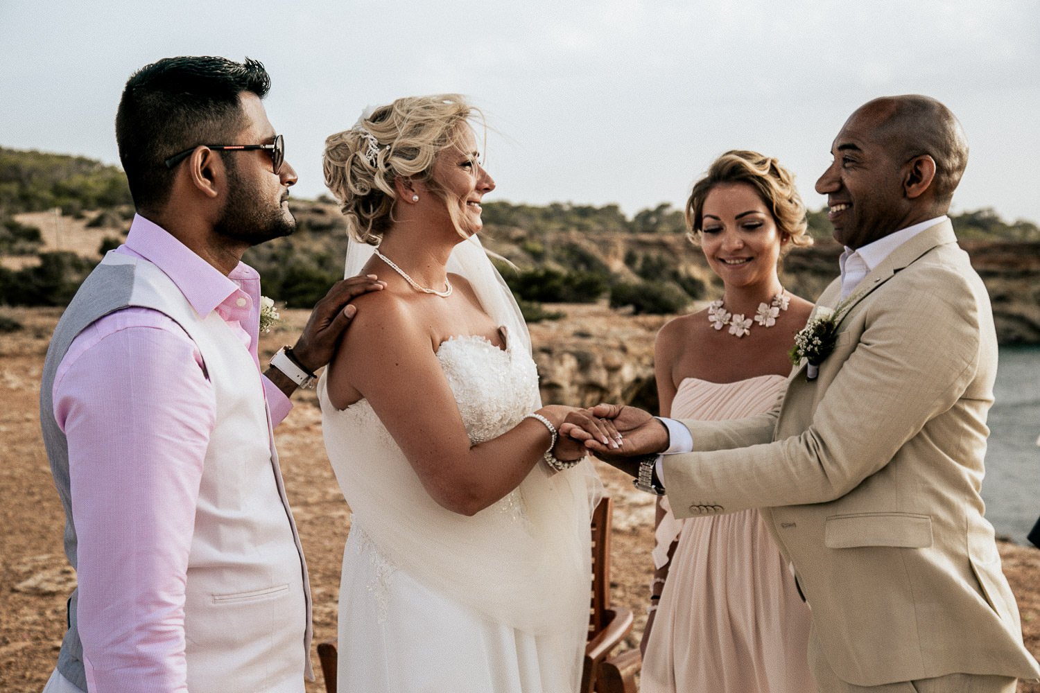 Friends sharing a moment with the couple during the ceremony