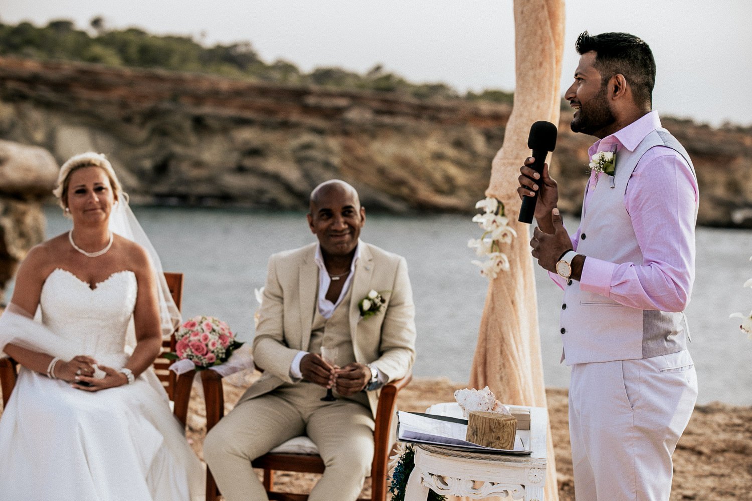 A friend speaking at Mike and Monica’s seaside wedding