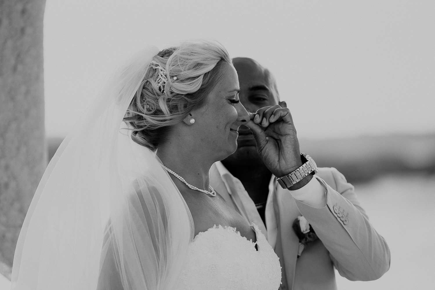 Black and white photograph of Monica and Mike laughing together