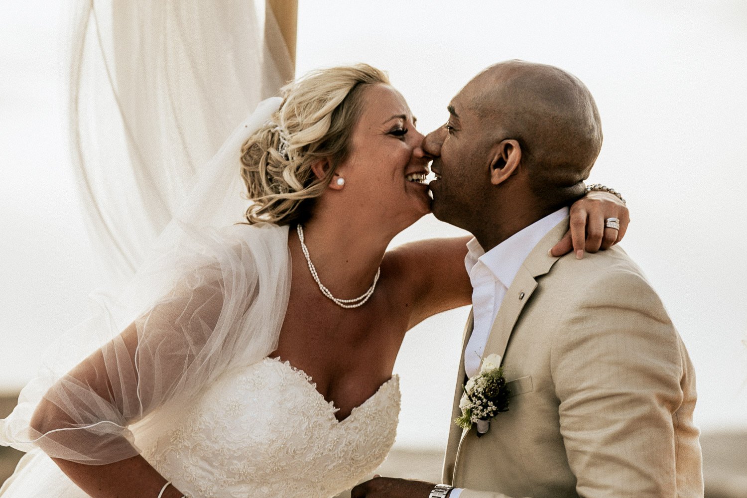 Mike and Monica kissing during their wedding ceremony