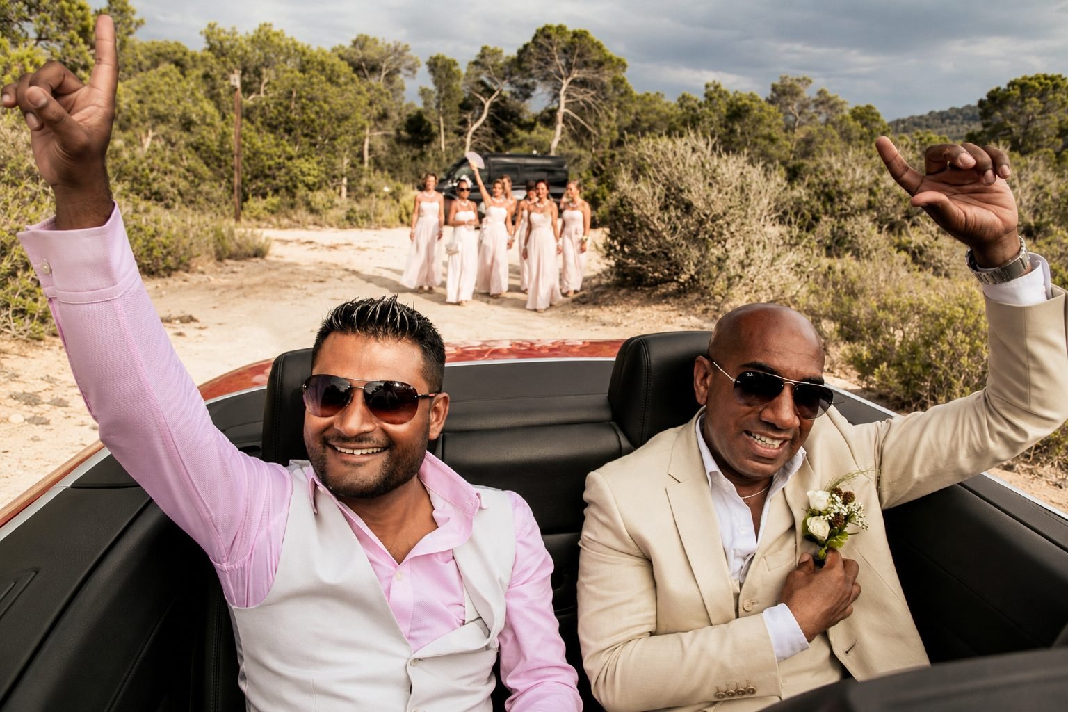 Mike and Monica together in their open-top wedding car in Ibiza